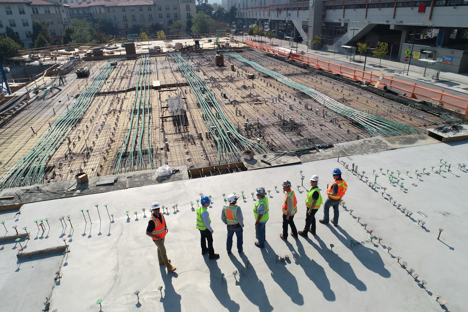 A construction team reviewing a building site
